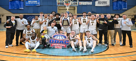 The Randolph-Macon men’s basketball team with the O.D.A.C. Championship trophy. (Photo credit: O.D.A.C.)