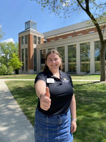 Mary Nou (’25) giving a thumbs up outside of Payne Hall.  
Photo credit: Anna Darling
